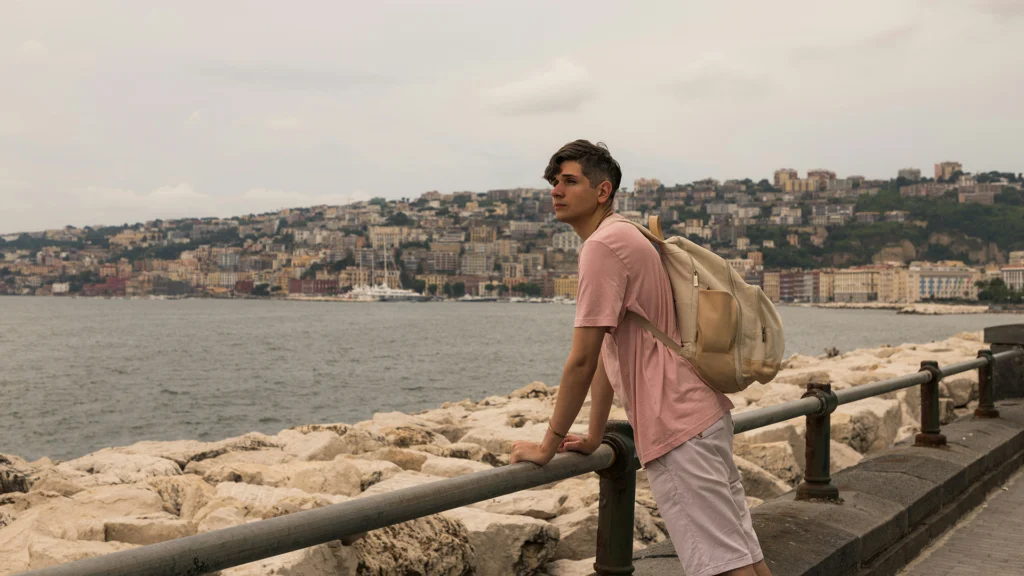 young man looks out over the sea
