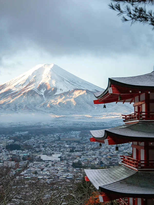 Mount Fuji overlooking traditional pagoda and city in Japan, iconic study abroad destination.