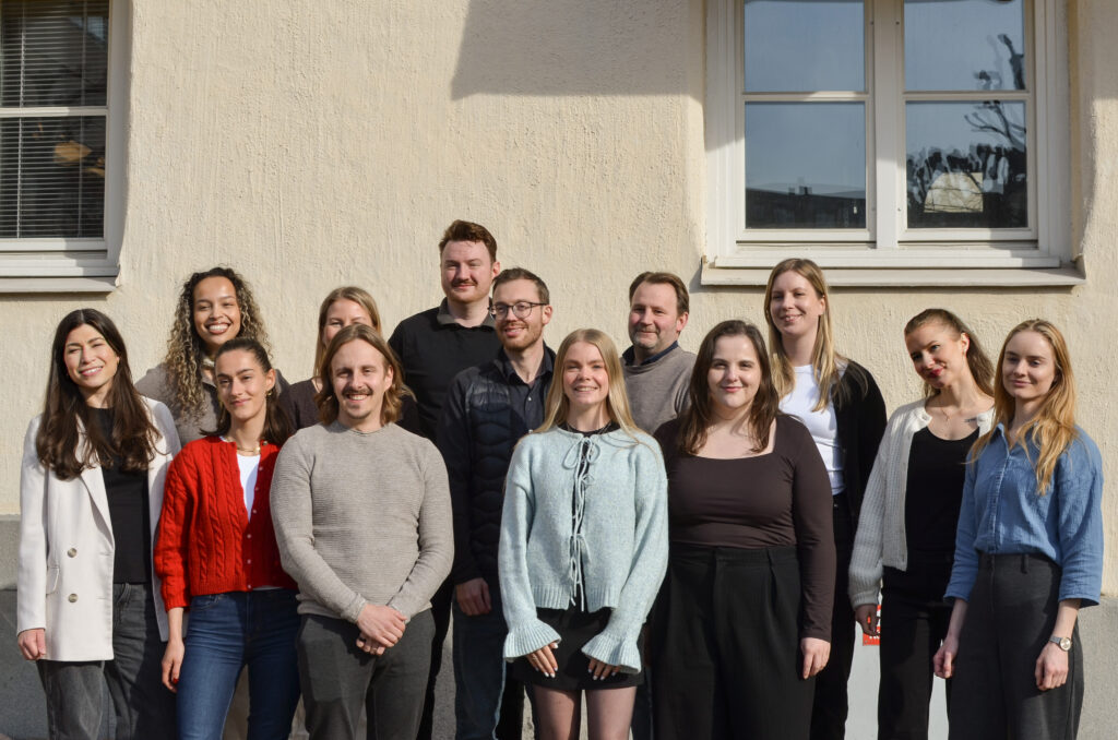 Group photo of the SONOR team standing together outside the Beyond Abroad office during a company team gathering