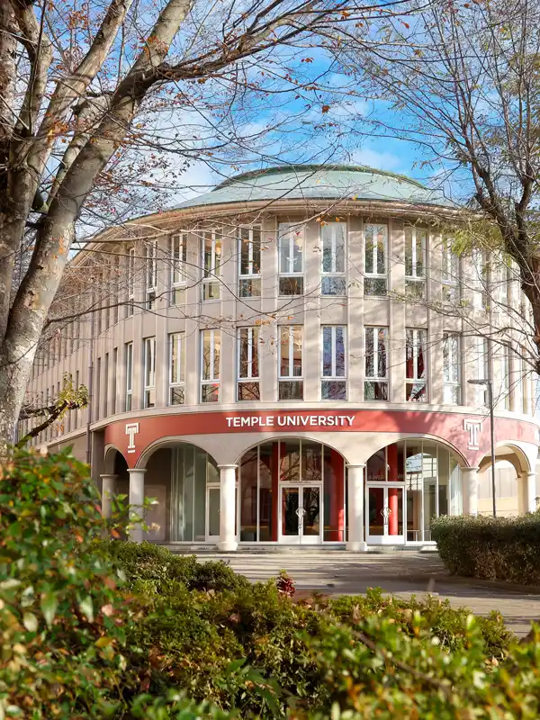 Temple University Japan campus with trees and outdoor areas in Tokyo.
