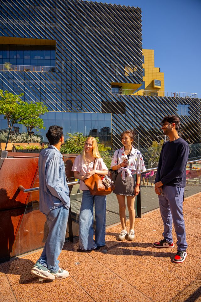 Postgraduate international students chatting at Edith Cowen University