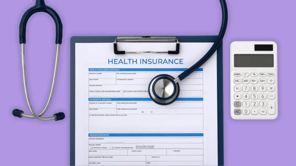 Health insurance documents, next to a calculator